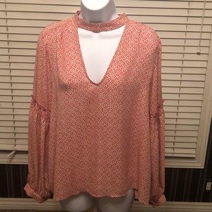 Pink and white patterned blouse